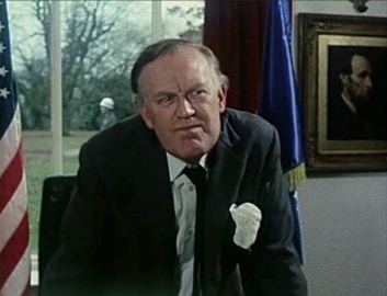 Joss Ackland as USA President in movie The Strange Case of the End of Civilization as We Know It (1977)