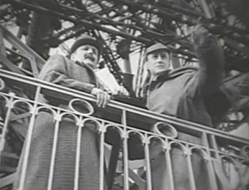 Holmes and Watson on top of Eiffel Tower