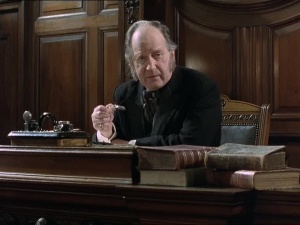 James Bree as the Coroner in episode The Empty House (1986)
